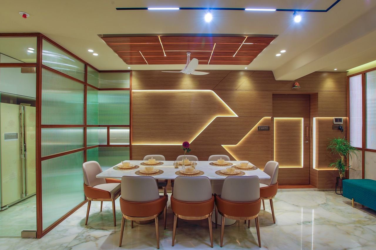 Elegant dining room with modern furniture and illuminated wood paneling for a contemporary look.